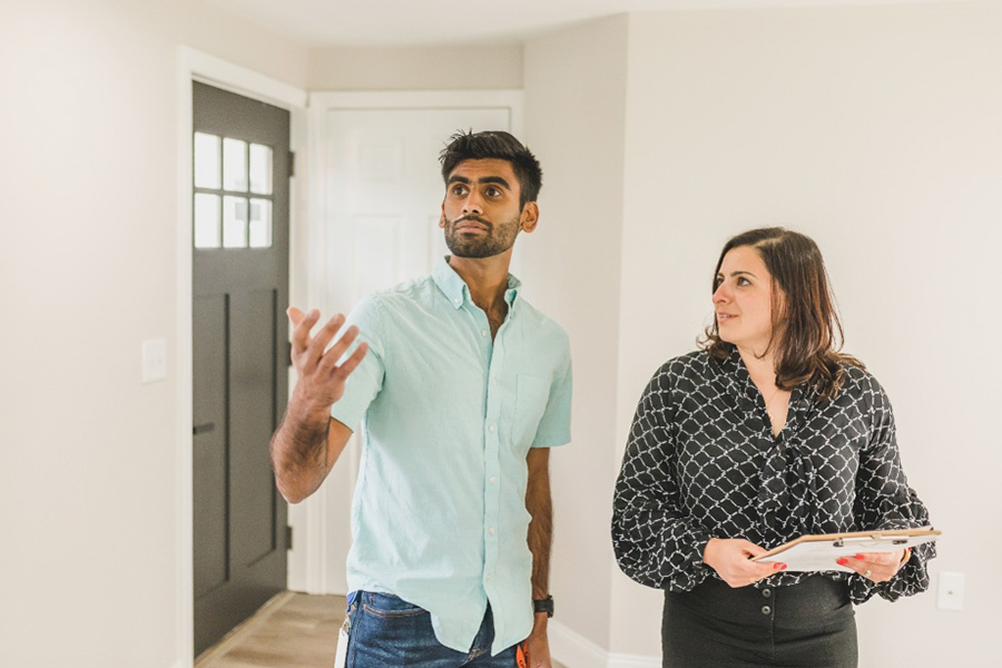 Realtor Showing a Client a House for Sale