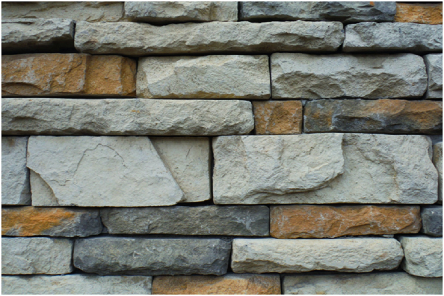 A photo showing a close-up view of a concrete brick wall.